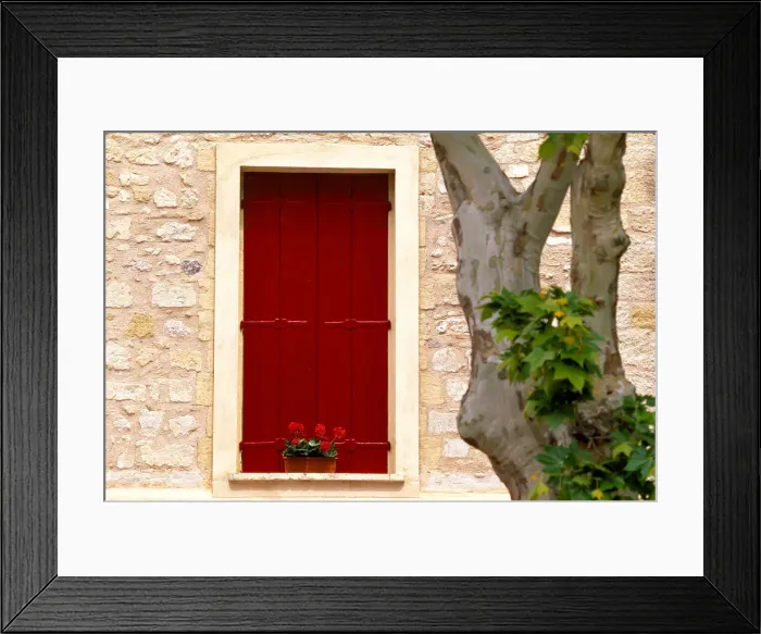 Framed Print : Dark red shutters in the wall of a house in France Framed Print : Dark red shutters in the wall of a house in France