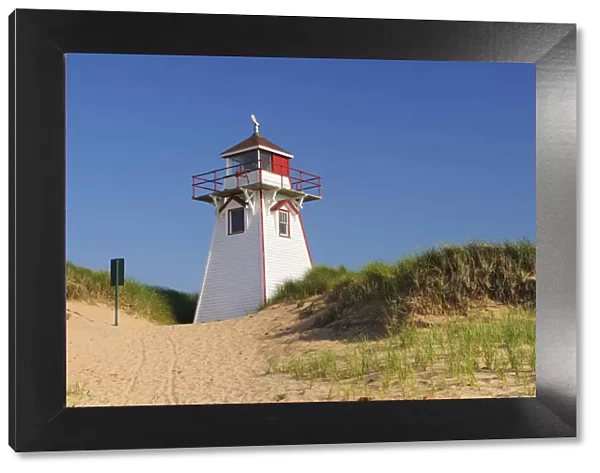 Canada, Prince Edward Island. Lighthouse in sand dune at Covehead Harbour. Credit as