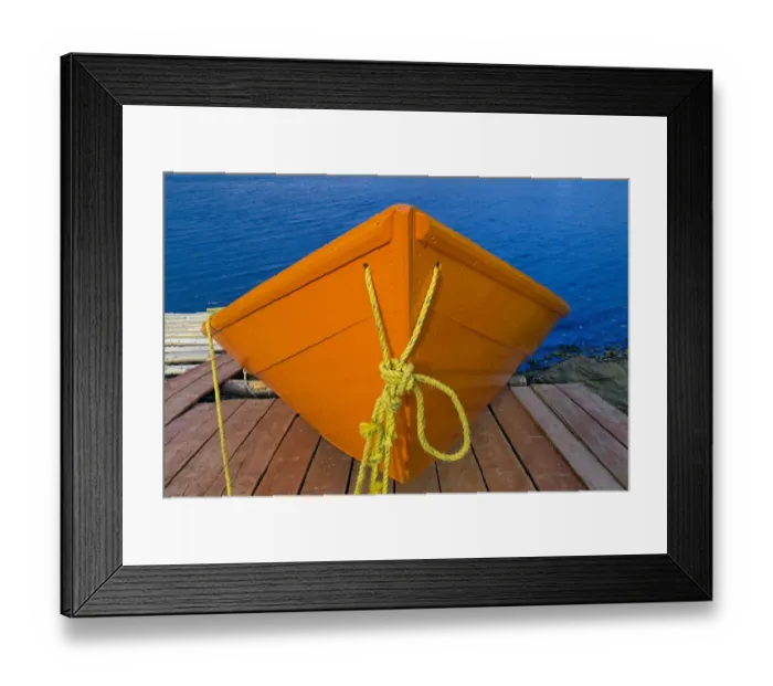 Framed Print : Canada, Newfoundland, Frenchman Cove. Orange boat on dock