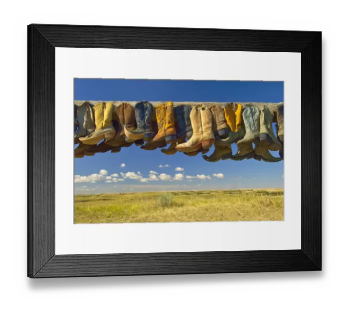 Framed Print : Canada, Saskatchewan, Great Sand Hills. Old cowboy boots on posts on prairie. Credit as Framed Print : Canada, Saskatchewan, Great Sand Hills. Old cowboy boots on posts on prairie. Credit as