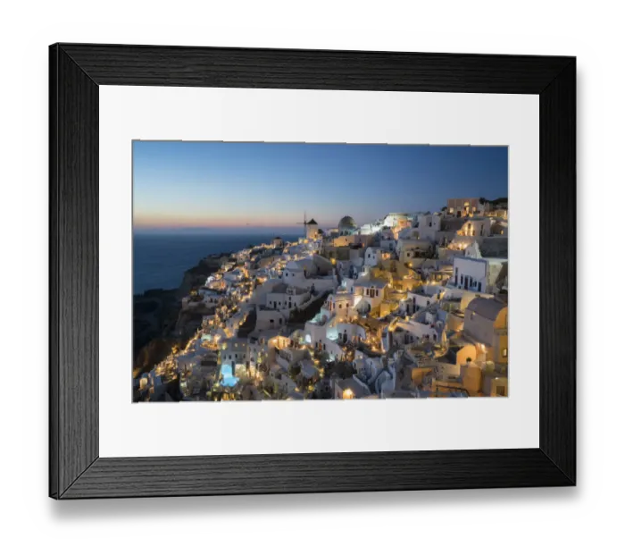 Framed Print : Greece, Santorini. The village of Oia glowing in the post-sunset light as the town s Framed Print : Greece, Santorini. The village of Oia glowing in the post-sunset light as the town s