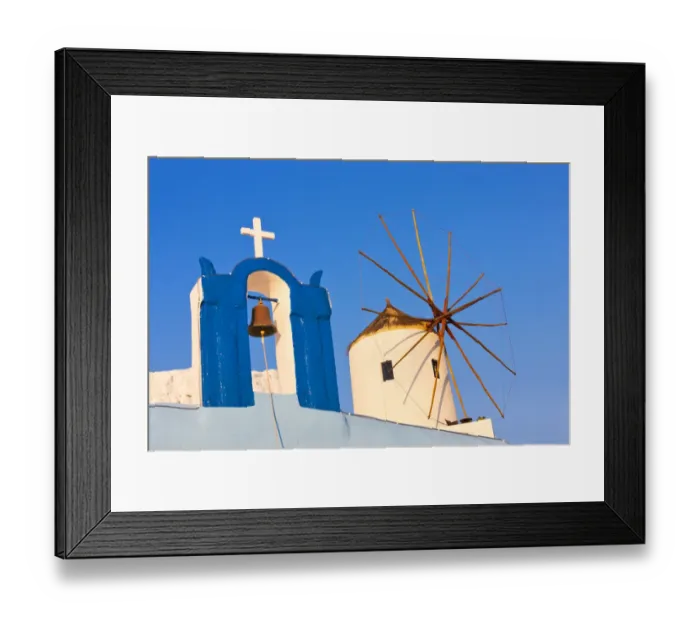 Framed Print : Church bell tower and windmill on the coast of Aegean Sea. Oia, Santorini Island, Greece Framed Print : Church bell tower and windmill on the coast of Aegean Sea. Oia, Santorini Island, Greece