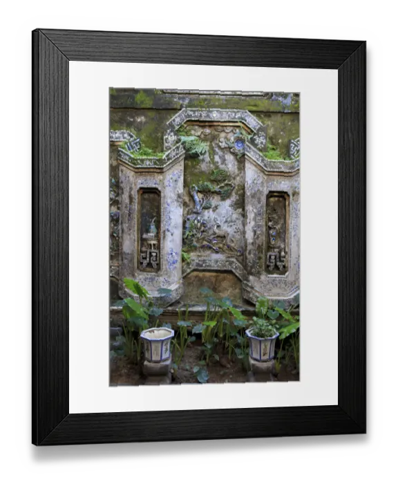 Framed Print : The wall of an inside courtyard in Quan Thang House in Hoi An, Vietnam Framed Print : The wall of an inside courtyard in Quan Thang House in Hoi An, Vietnam