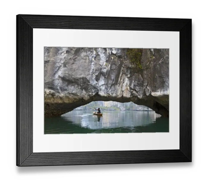 Framed Print : Ha Long Bay, Vietnam. View of kayaker through limestone arch
