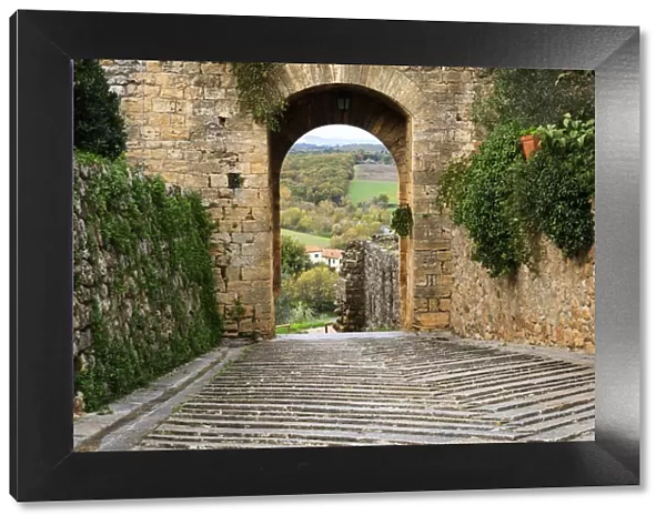 Italy, Monteriggioni. Arched exit-way through city walls