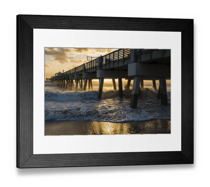 Framed Print : Juno Beach, Florida, Man watches high surf from the pier at Juno Beach