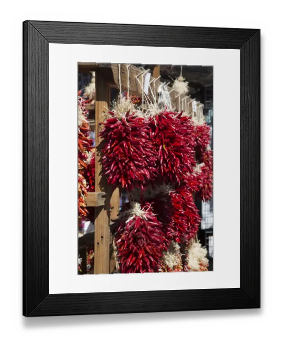Framed Print : USA, Santa Fe, New Mexico. Chile peppers hang in the market