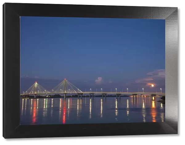 Clark Bridge at dusk-night over Mississippi River and full moon Alton, IL