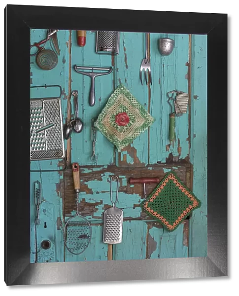 USA, Montana, Missoula. Old fashioned kitchen implements displayed on weathered door