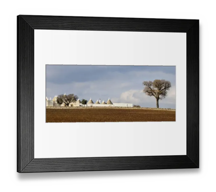 Framed Print : Several typical Trulli homes outside of the town of Alberobello