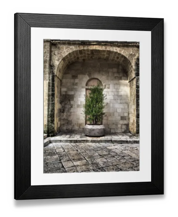 Framed Print : Italy, Bari, Apulia, Monopoli. Arch with potted plants in the courtyard near the Basilica