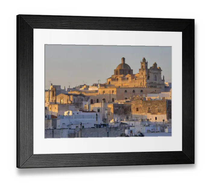 Framed Print : The picturesque old town of Ostuni in southern Italy, built on top of a hill and crowned Framed Print : The picturesque old town of Ostuni in southern Italy, built on top of a hill and crowned