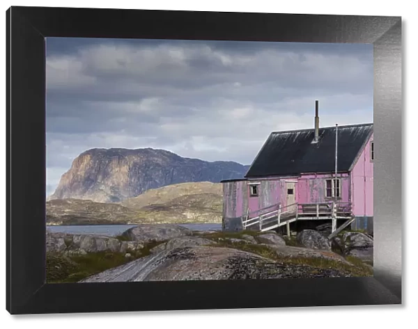 Greenland, Itilleq. Worn pink house