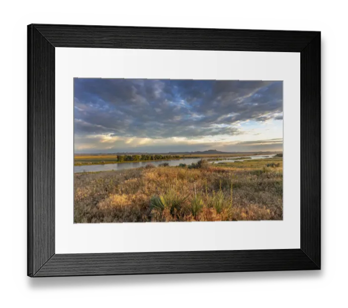 Framed Print : Sunrise and clouds over the Yellowstone River at the confluence with the Powder River near Terry