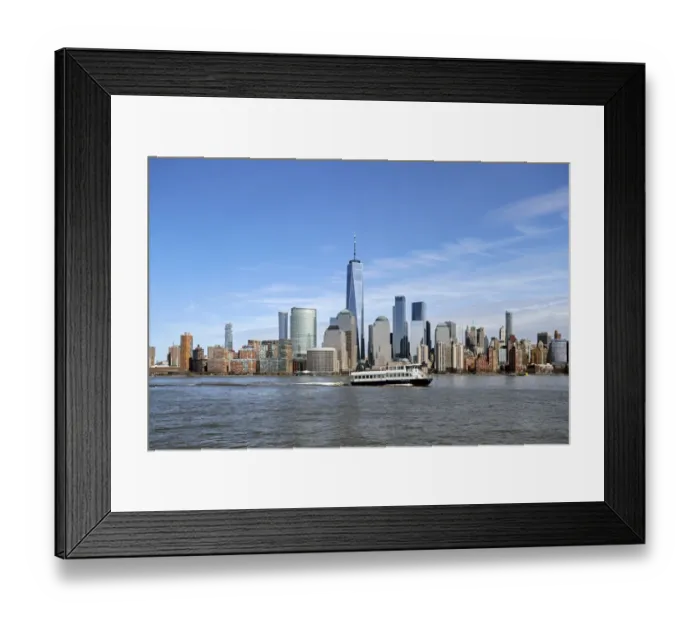 Framed Print : A ferry on the Hudson River passes by One World Trade Center and Manhattan buildings