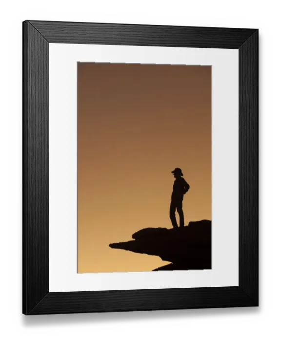 Framed Print : Man standing on rock surveying the view. (MR)