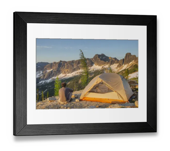 Framed Print : Adult man at daybreak sitting next to backpacking tent and gazing at view of Cutthroat Framed Print : Adult man at daybreak sitting next to backpacking tent and gazing at view of Cutthroat