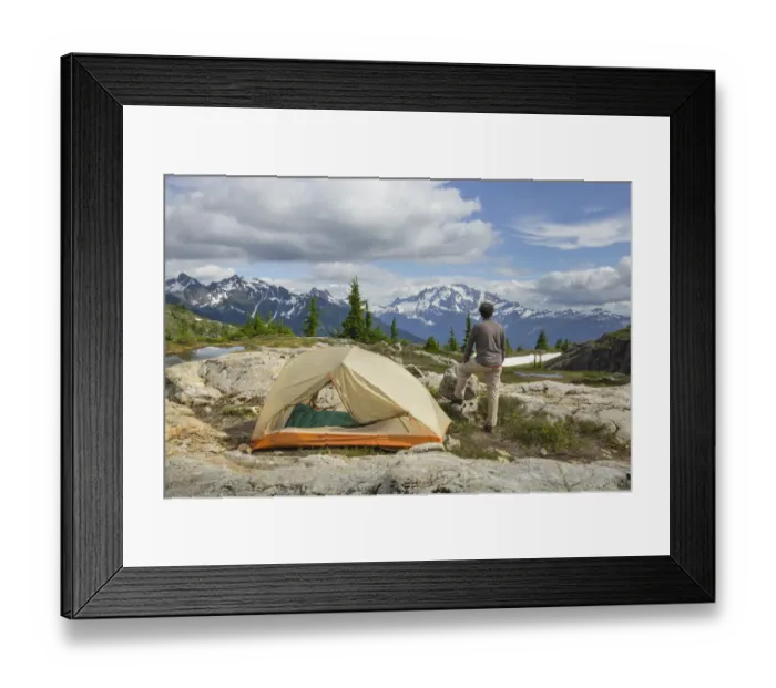 Framed Print : Adult man admiring view from backcountry campsite Framed Print : Adult man admiring view from backcountry campsite