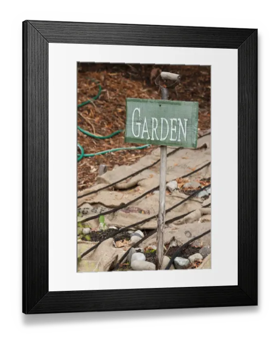 Framed Print : Issaquah, Washington State, USA. Garden sign and burlap bags covering dormant vegetable garden