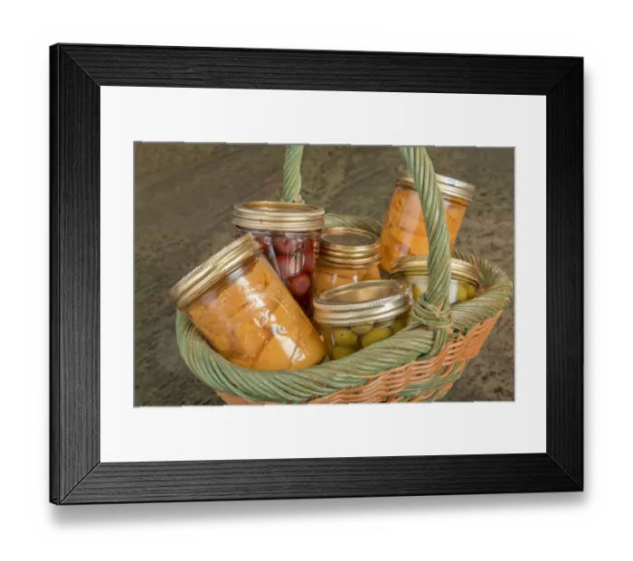 Framed Print : Wicker basket of home canned foods (peaches, olives and cherries) on a granite countertop Framed Print : Wicker basket of home canned foods (peaches, olives and cherries) on a granite countertop
