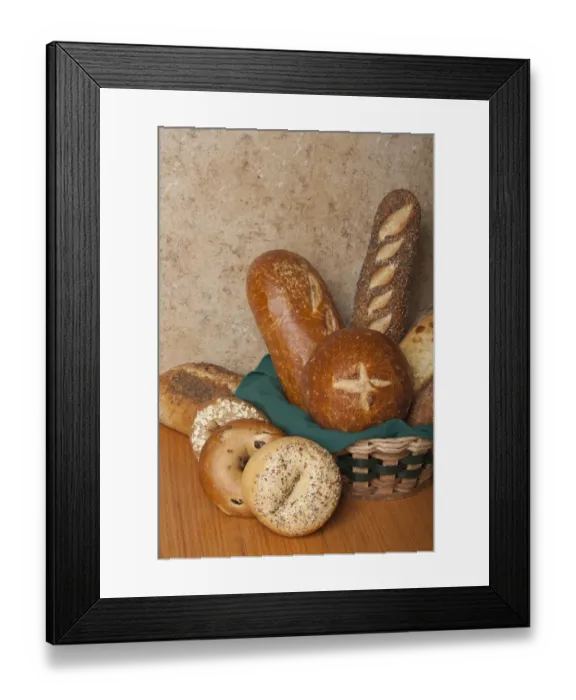 Framed Print : Variety of homemade breads. Sourdough bread bowl, sourdough loaf, three seed loaf