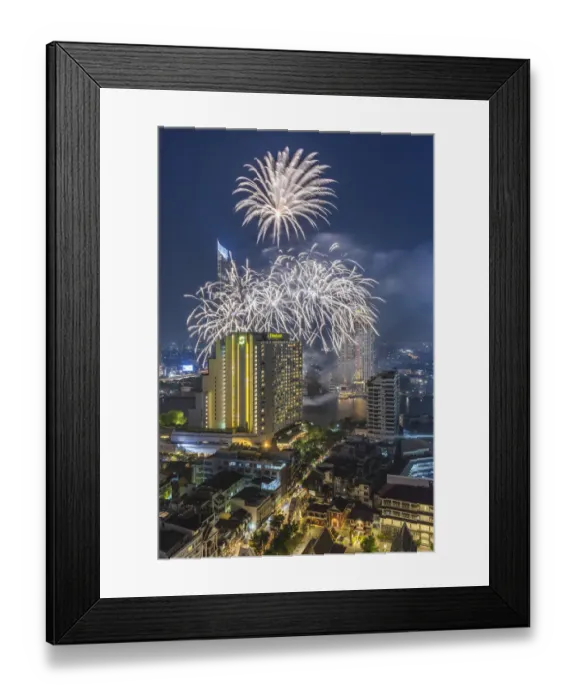 Framed Print : Thailand, Bangkok. Riverside, high angle skyline view with fireworks at dusk