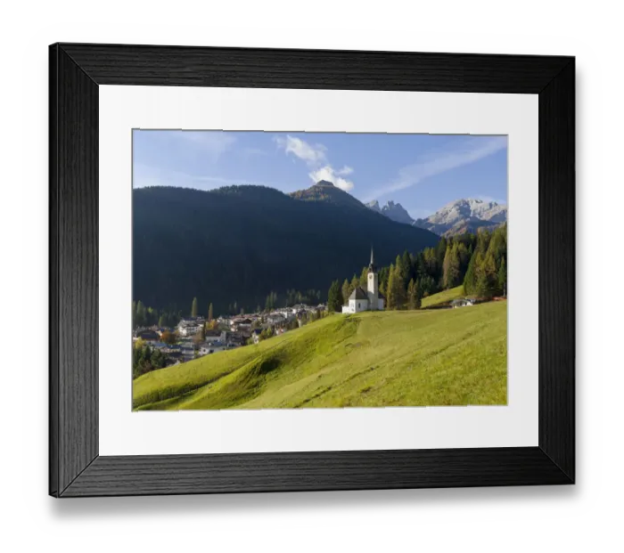 Framed Print : The church, in the background Focobon mountain range in the Pale di San Martino