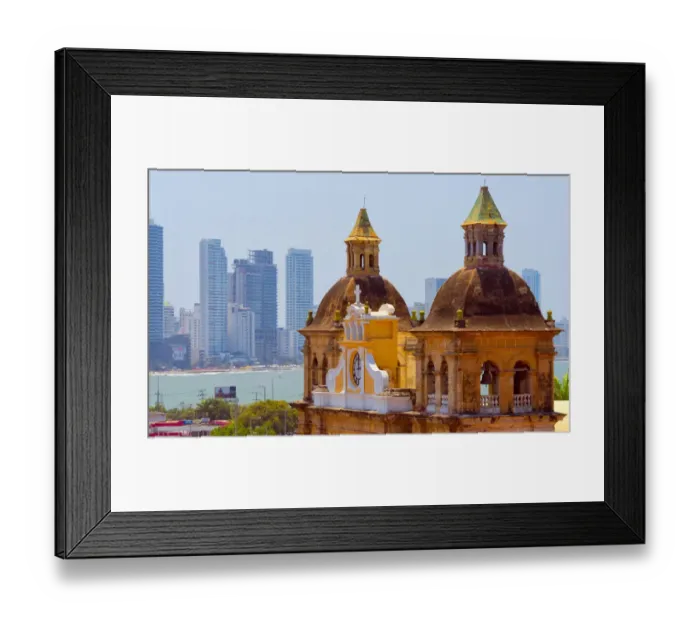 Framed Print : Iglesia de San Pedro Claver in the old town, high-rises of the new city in the background