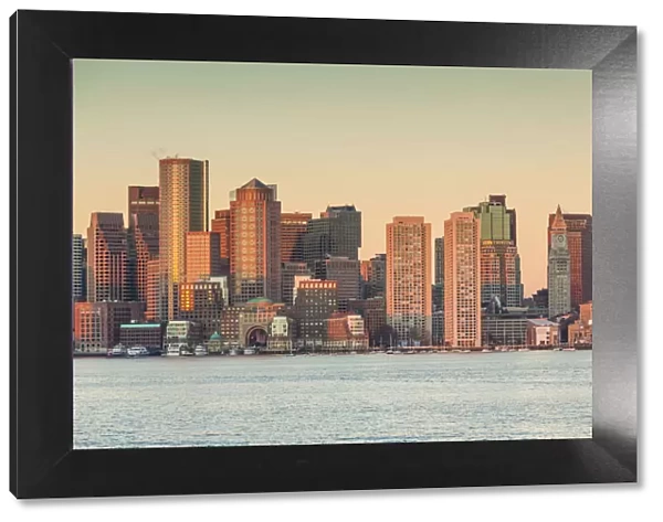 USA, Massachusetts, Boston. City skyline from Boston Harbor at dawn