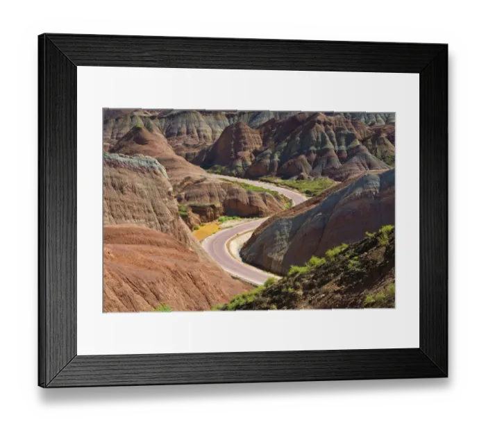 Framed Print : A winding road through the colorful mountains in Zhangye National Geopark