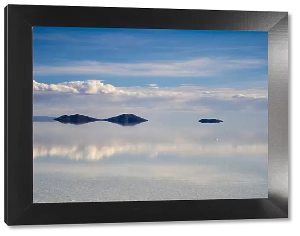 Reflection of clouds on the surface of the salt flat covered with water, Salar de Uyuni