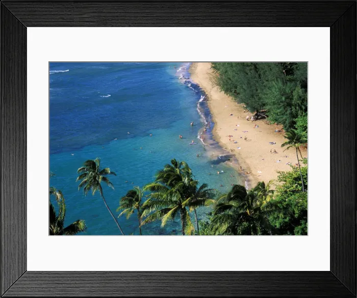 Framed Print : Sunbathers and blue Pacific waters at Ke e Beach, North Shore, Island of Kauai