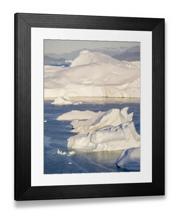 Framed Print : Iceberg in the Uummannaq Fjord System. Glaciated Nuussuaq peninsula in the background