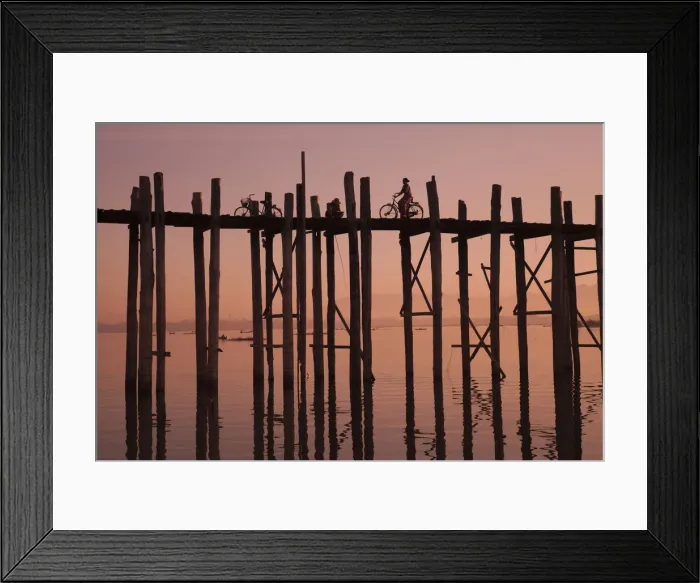 Framed Print : Monk walking at sunrise over the lake near wooden footbridge Framed Print : Monk walking at sunrise over the lake near wooden footbridge