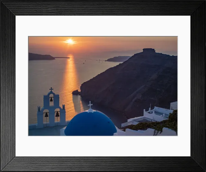Framed Print : Blue dome church and famous three bells with cross and steeple in Fira, Santorini, Greece Framed Print : Blue dome church and famous three bells with cross and steeple in Fira, Santorini, Greece