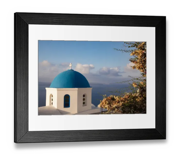 Framed Print : Blue domed Greek Orthodox church with bougainvillea flowers in Oia, Santorini, Greece Framed Print : Blue domed Greek Orthodox church with bougainvillea flowers in Oia, Santorini, Greece