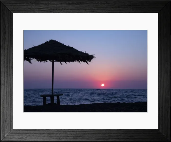 Framed Print : Silhouette of an excited man jumping on black sand beach early morning sunrise in