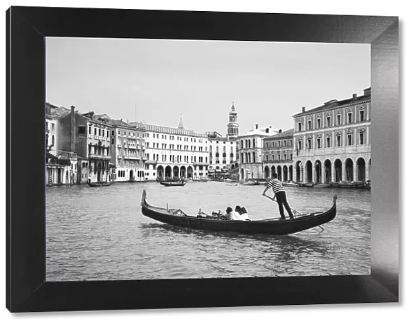 Europe, Italy, Venice. Black and white of gondolas plying Grand Canal