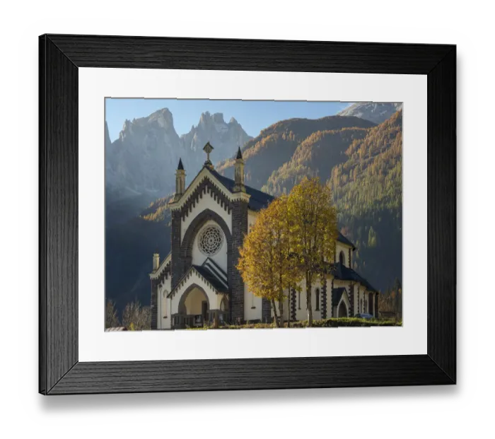 Framed Print : Chiesa di San Sebastiano in Falcade in Val Biois, in the background the Focobon mountain Framed Print : Chiesa di San Sebastiano in Falcade in Val Biois, in the background the Focobon mountain