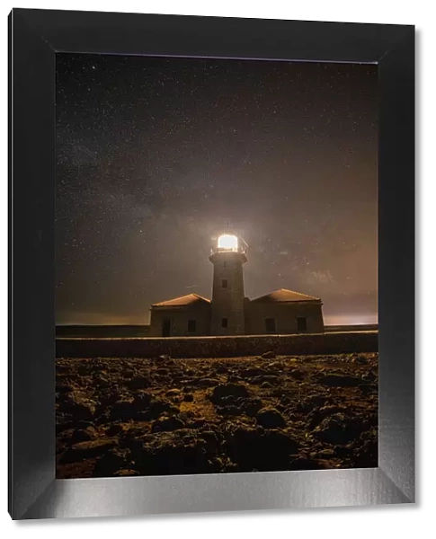 Spain, Menorca. Milky Way over the lighthouse