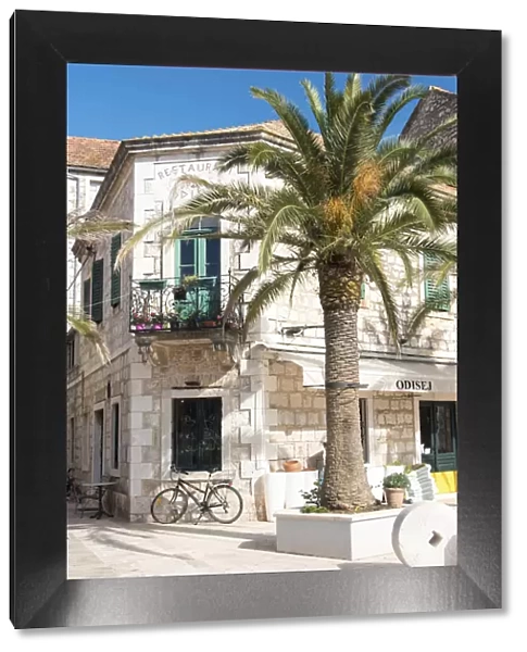 Croatia, Hvar Island, Stari Grad. Uncrowded. Bicycle parked at cafe