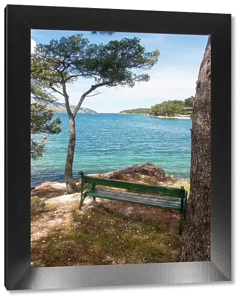 Croatia, Hvar Island, Stari Grad. Picturesque waterfront spot for bench