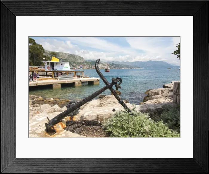 Framed Print : Croatia, Dubrovnik. Ferry dock Lokrum Island framed by old anchor Framed Print : Croatia, Dubrovnik. Ferry dock Lokrum Island framed by old anchor