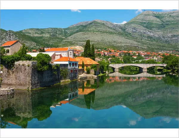 Stone bridge and old town by Trebisnjica River, Trebinje, Bosnia and Herzegovina