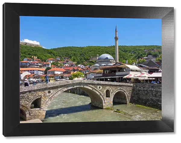 Stone bridge, Sinan Pasha Mosque and houses in the old town on the banks of the Prizren