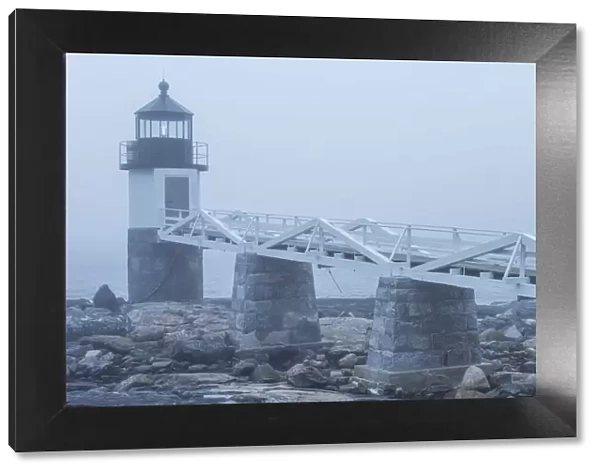 USA, Maine, Port Clyde. Marshall Point Lighthouse in the fog