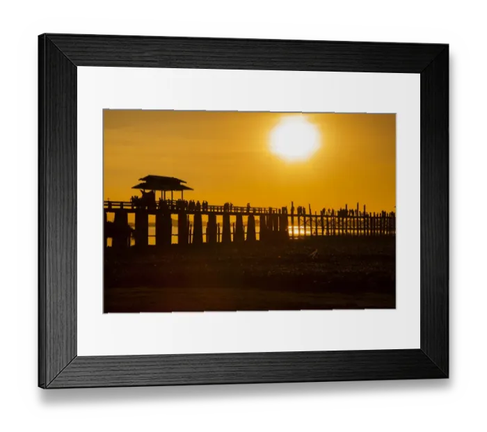 Framed Print : Sunset over the lake near wooden footbridge. U Bein Bridge crossing the Taungthaman Lake