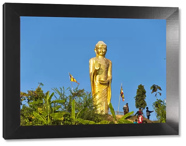 A golden statue of Buddha on the bank of Kaptai Lake, Rangamati, Chittagong Division
