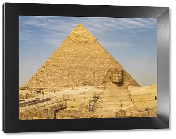 Africa, Egypt, Cairo. Giza plateau. Great Sphinx of Giza in front of the Pyramid of