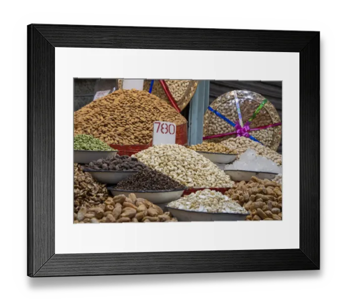 Framed Print : India, Delhi, Old Delhi. Old Delhi street market. Assorted nuts, spices and snacks